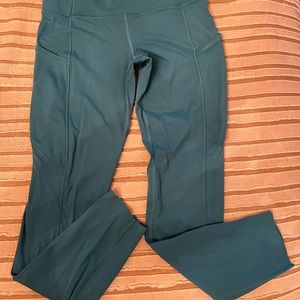 Lululemon size 6 turquoise leggings with pockets on sides and back